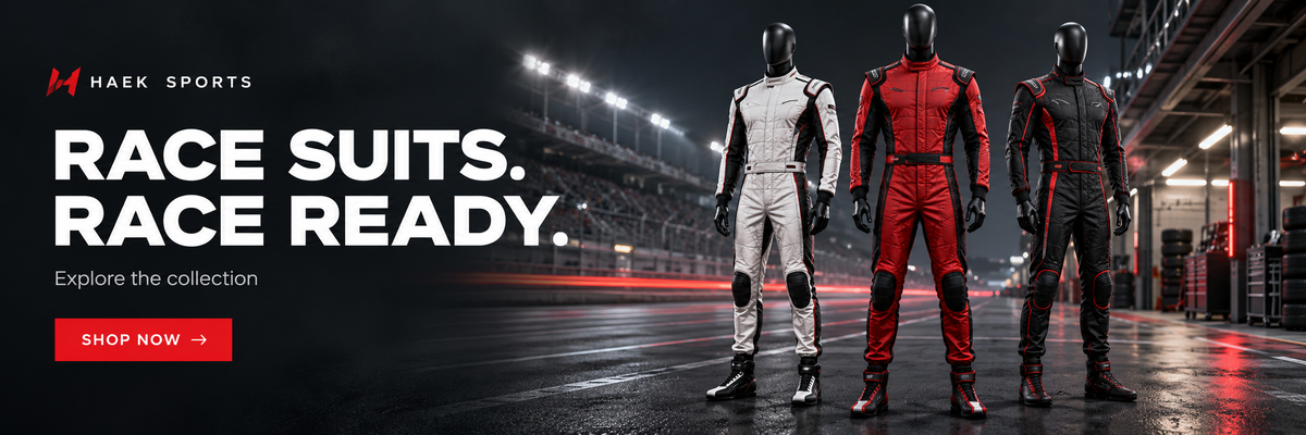 Haak Sports promotional banner showing three full-body racing suits on a racetrack: a white suit, a red-and-black suit, and a dark gray suit. Large text reads 'RACE SUITS.